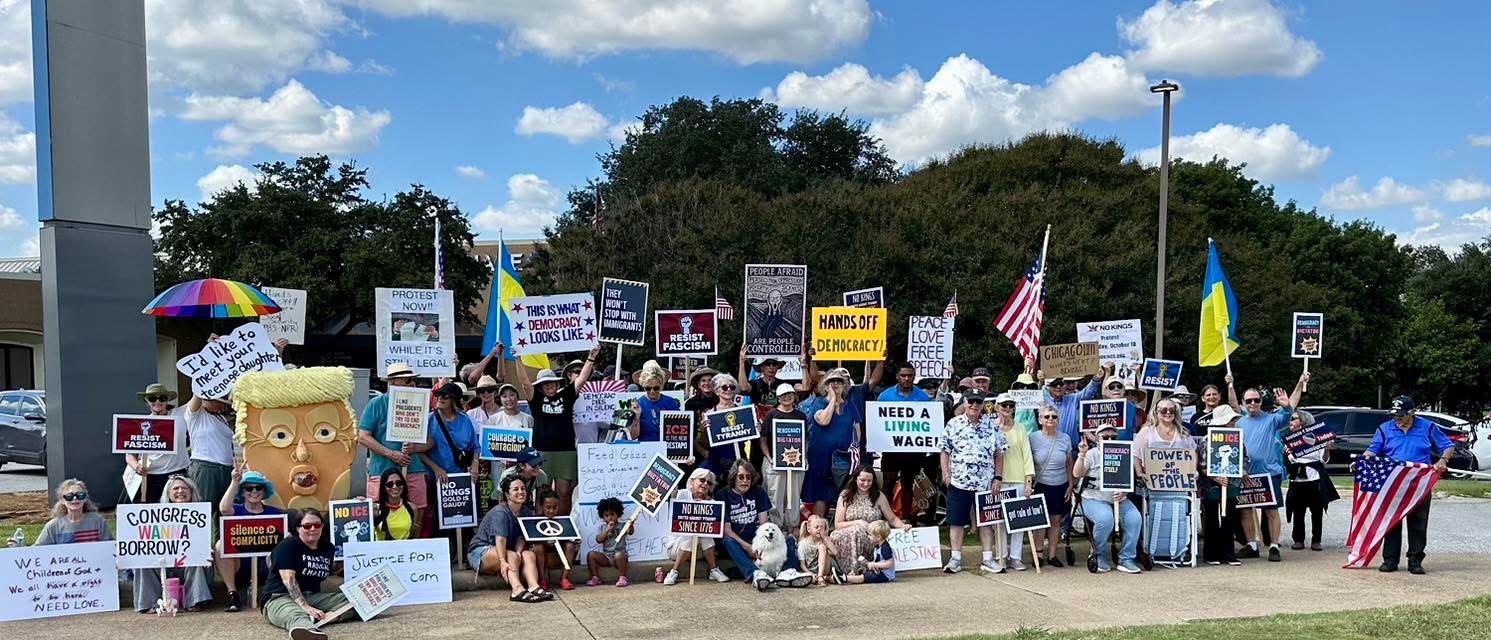 Chelsey Hockett standing with a group of supporters outside